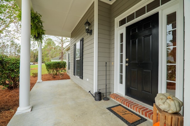 property entrance with covered porch