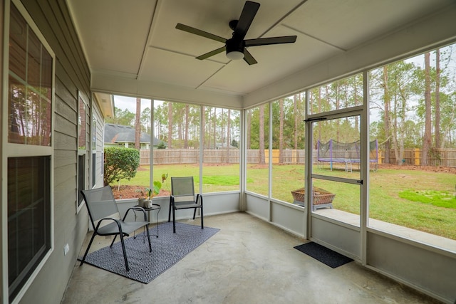 sunroom featuring ceiling fan