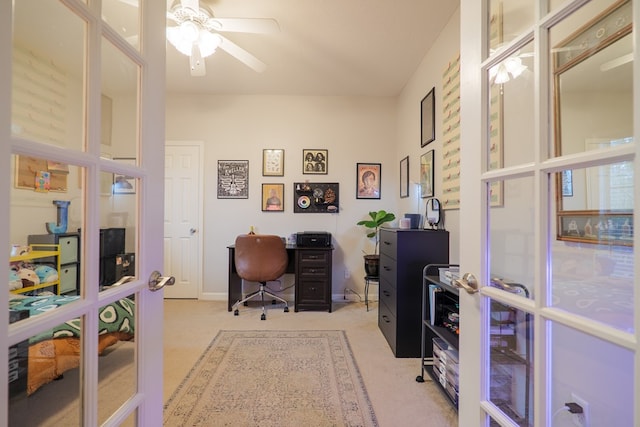 home office with light carpet, french doors, and ceiling fan