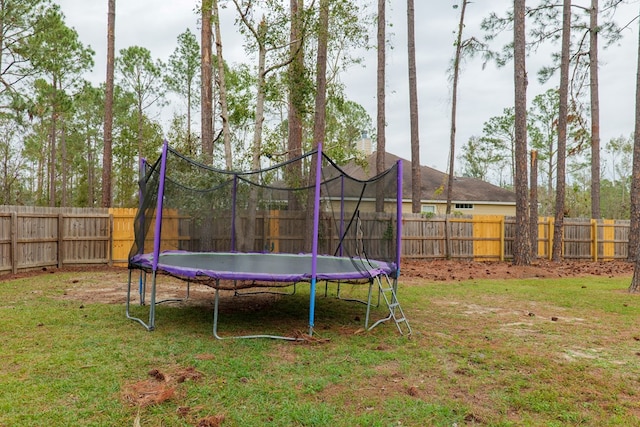 view of yard with a trampoline