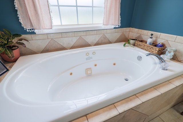 bathroom featuring tiled tub