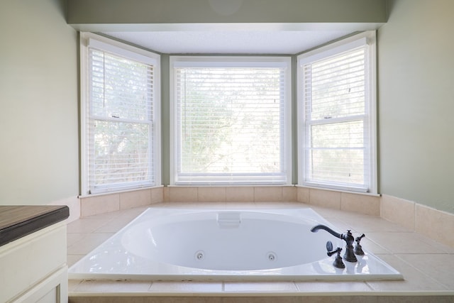 full bath featuring a tub with jets