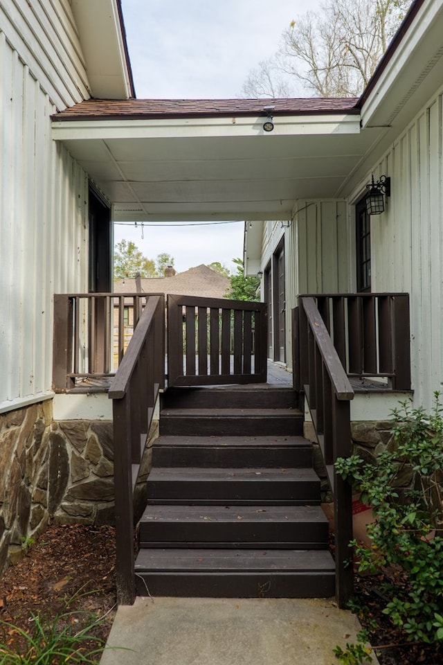 view of exterior entry with board and batten siding