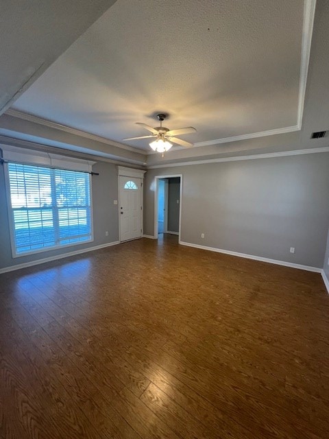3664 Druid Oaks Dr, Valdosta, GA 31602 - empty room featuring dark wood finished floors, visible vents, baseboards, and ceiling fan