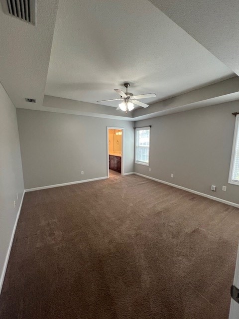 3664 Druid Oaks Dr, Valdosta, GA 31602 - carpeted spare room with visible vents, a textured ceiling, a ceiling fan, and baseboards