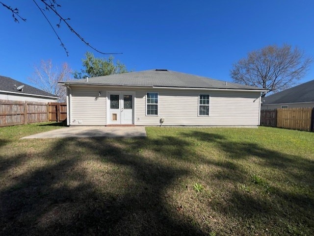 3664 Druid Oaks Dr, Valdosta, GA 31602 - rear view of house with a patio area, a lawn, and a fenced backyard