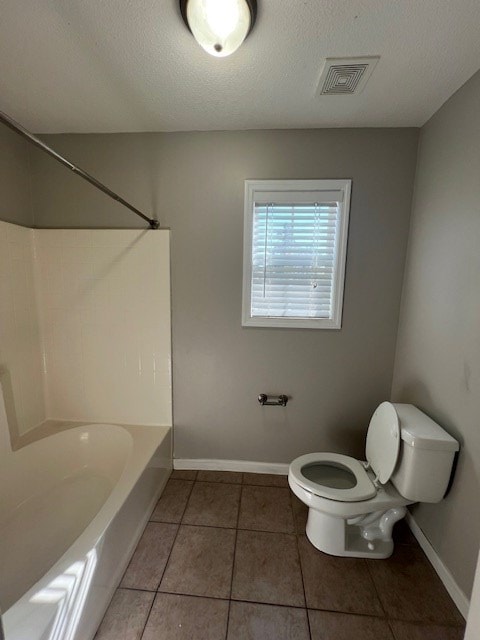 3664 Druid Oaks Dr, Valdosta, GA 31602 - bathroom featuring visible vents, baseboards, toilet, and tile patterned flooring