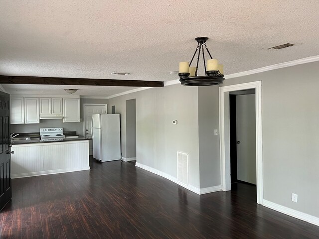 kitchen featuring a textured ceiling, white appliances, crown molding, dark hardwood / wood-style floors, and white cabinetry