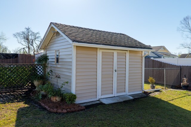 view of shed with a fenced backyard