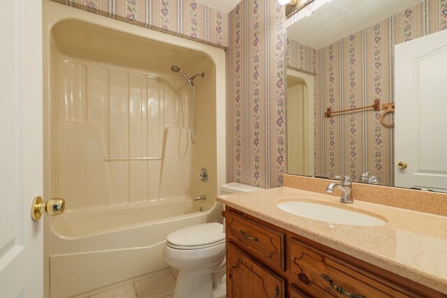 bathroom with wallpapered walls, toilet, and tile patterned flooring