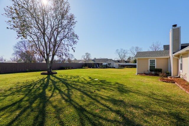 view of yard with fence