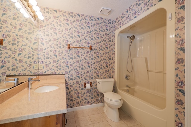 full bathroom with wallpapered walls, toilet, vanity, tile patterned floors, and a textured ceiling