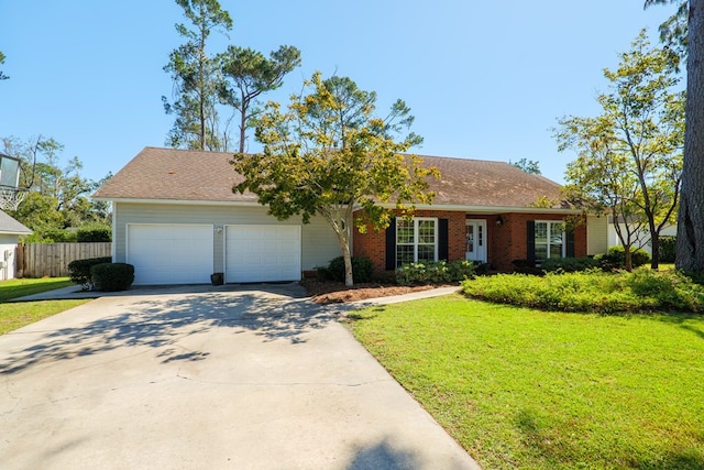 ranch-style home featuring a front lawn and a garage