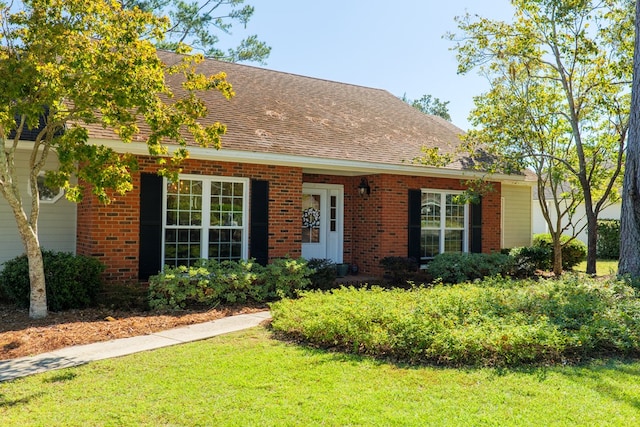 view of front of home with a front lawn