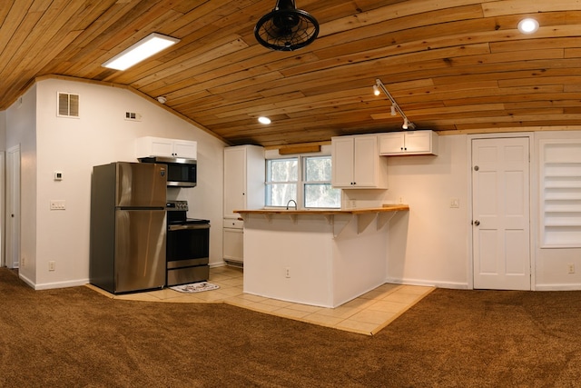 kitchen with visible vents, stainless steel appliances, white cabinetry, and light colored carpet