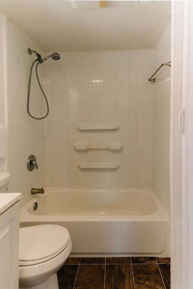 full bath featuring a textured ceiling, tub / shower combination, vanity, and toilet