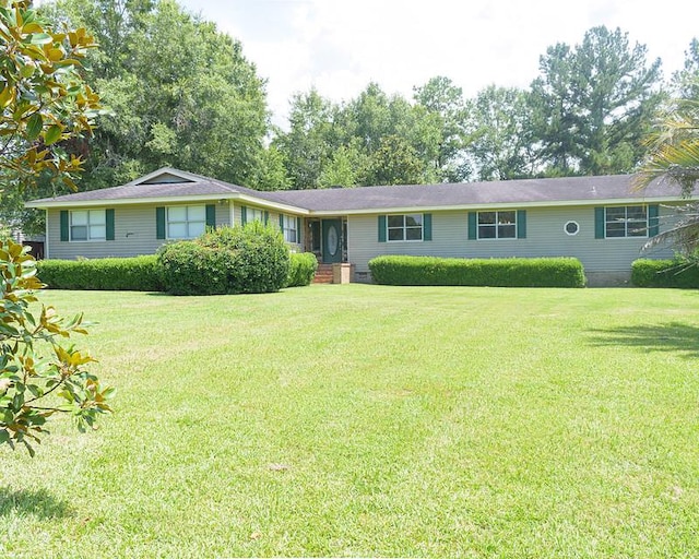 ranch-style home with a front lawn