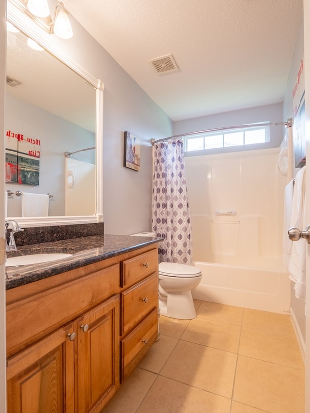 bathroom with tile patterned flooring, visible vents, shower / tub combo with curtain, and vanity