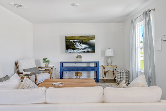 living area featuring a healthy amount of sunlight and visible vents