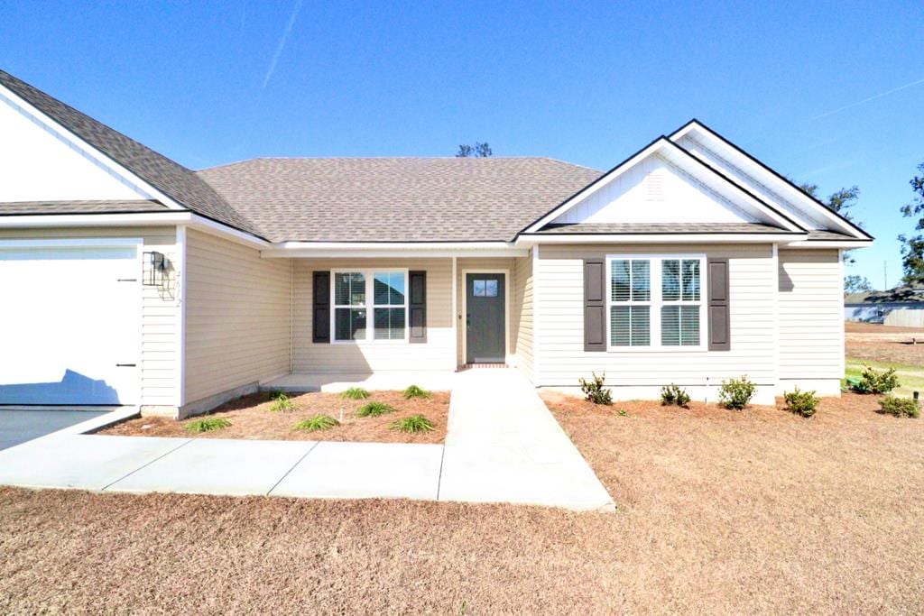 ranch-style house featuring a garage