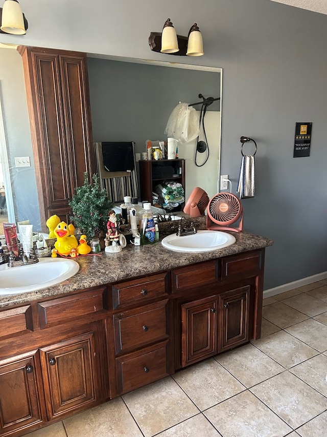 bathroom featuring tile patterned flooring and vanity