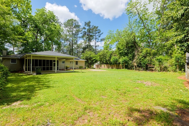 view of yard featuring a sunroom