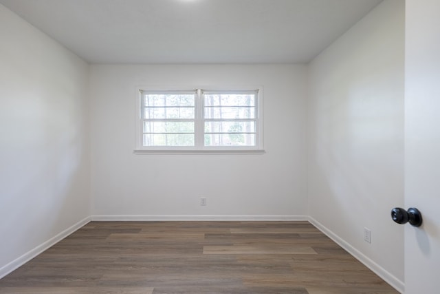 empty room featuring dark hardwood / wood-style flooring