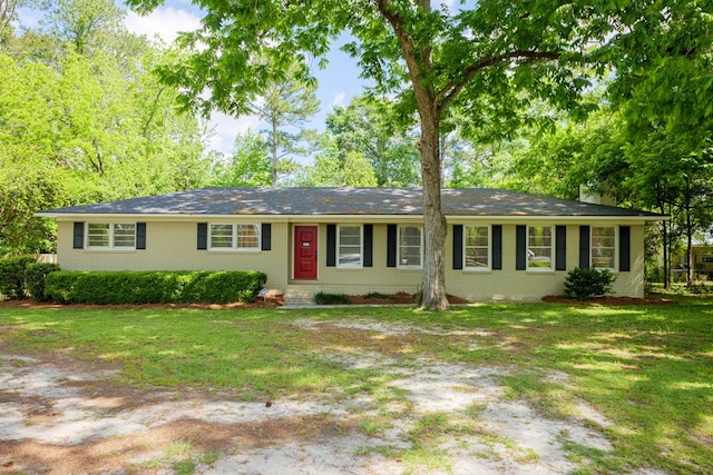 ranch-style home with a front yard