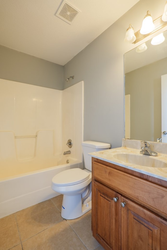 full bathroom featuring toilet, bathing tub / shower combination, vanity, visible vents, and tile patterned floors