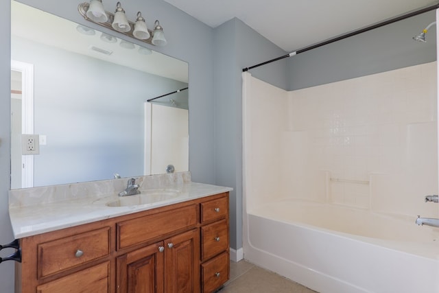 full bathroom featuring tile patterned flooring, bathtub / shower combination, visible vents, and vanity