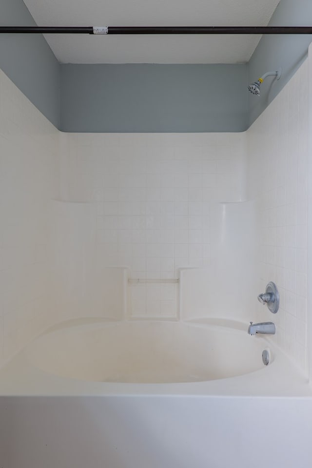 bathroom with shower / washtub combination