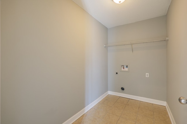 laundry area featuring laundry area, washer hookup, electric dryer hookup, and baseboards