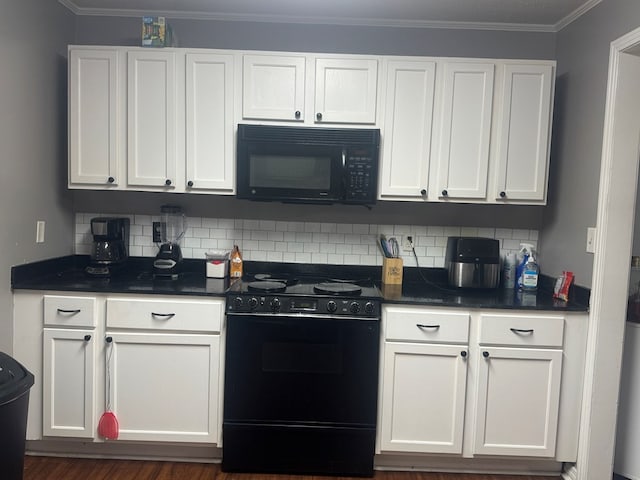 kitchen with white cabinetry, dark countertops, decorative backsplash, and black appliances