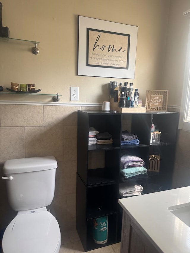 bathroom with toilet and tile patterned flooring