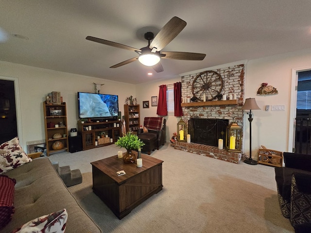 carpeted living room with a brick fireplace, ornamental molding, and ceiling fan