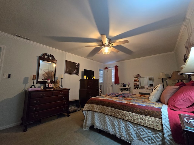 carpeted bedroom featuring ornamental molding and ceiling fan