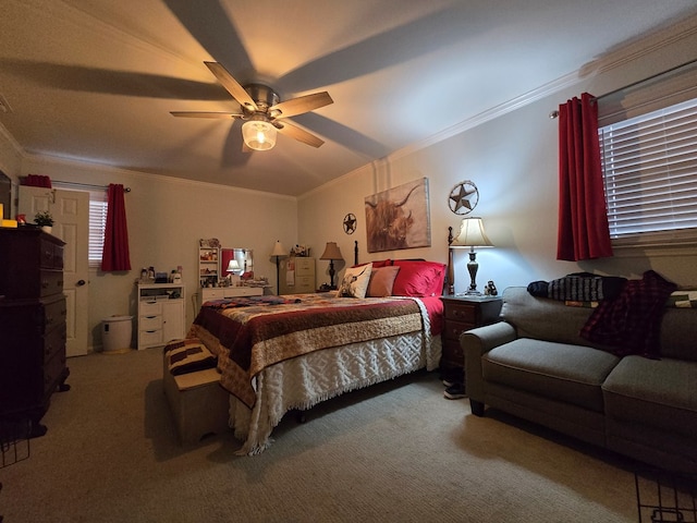 bedroom with ornamental molding, carpet flooring, and ceiling fan