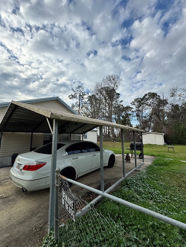 view of vehicle parking with a detached carport