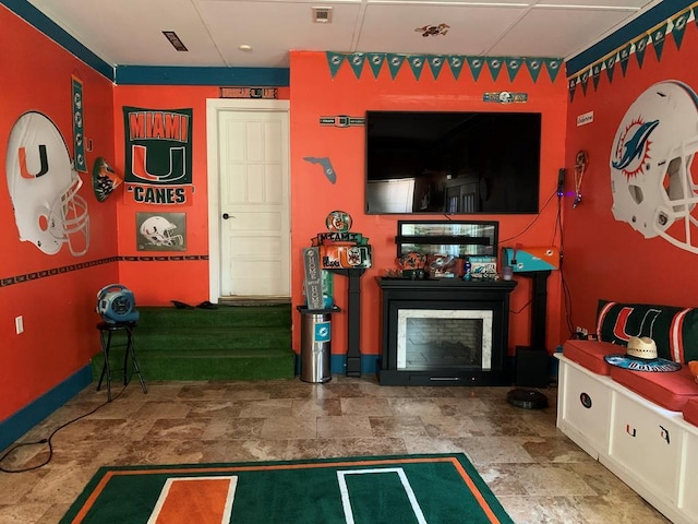 playroom with a fireplace and visible vents