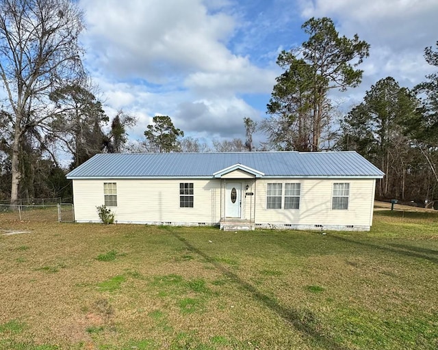 view of front of house featuring crawl space, a front yard, metal roof, and fence