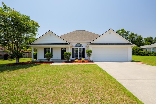 5702 Emily Ln, Hahira, GA 31632 - view of front of home featuring an attached garage, driveway, a front yard, and covered porch