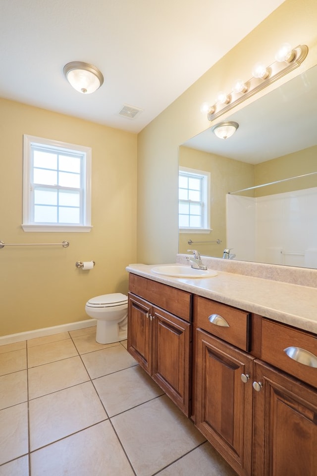 5702 Emily Ln, Hahira, GA 31632 - bathroom with tile patterned floors, toilet, vanity, and baseboards