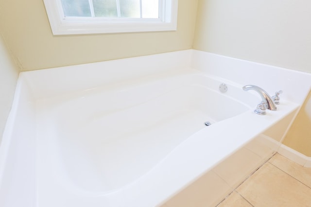 5702 Emily Ln, Hahira, GA 31632 - bathroom featuring a bath, tile patterned flooring, and baseboards