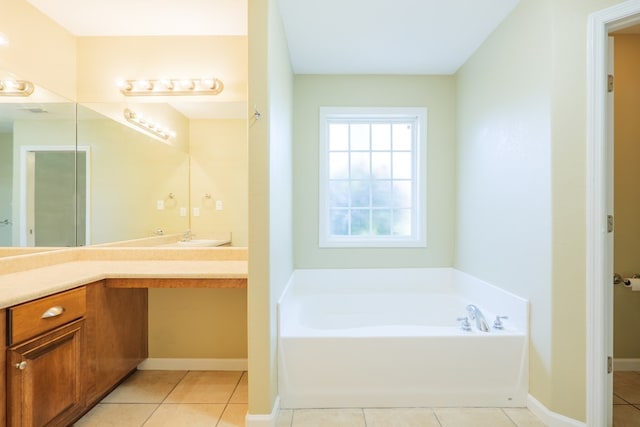 5702 Emily Ln, Hahira, GA 31632 - full bath with tile patterned flooring, a bath, vanity, and baseboards