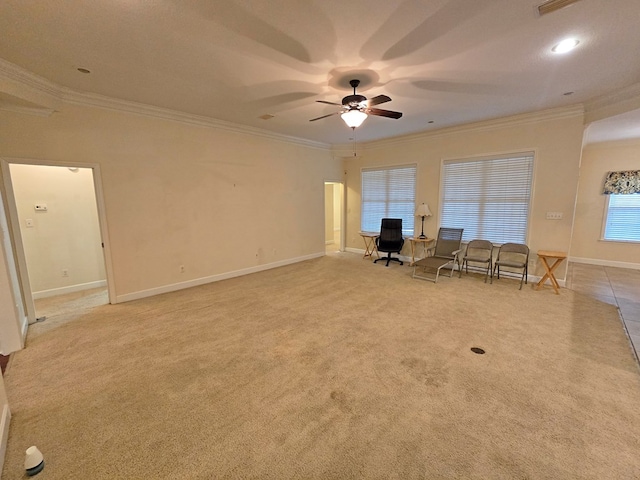 unfurnished living room with ceiling fan, ornamental molding, and light carpet