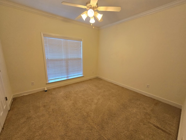 empty room featuring ornamental molding, carpet flooring, and ceiling fan