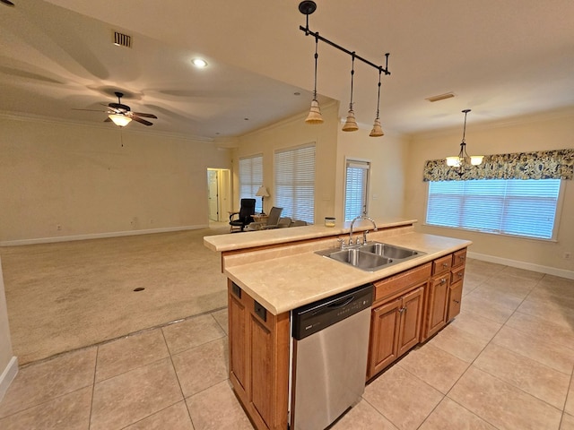 kitchen with pendant lighting, a kitchen island with sink, dishwasher, and sink