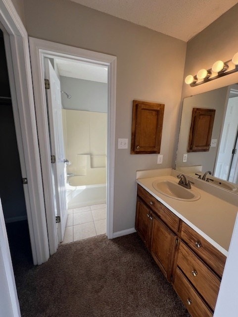 bathroom featuring vanity, tile patterned floors, and shower / washtub combination