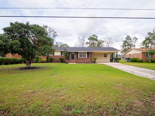 single story home with a front lawn and a carport