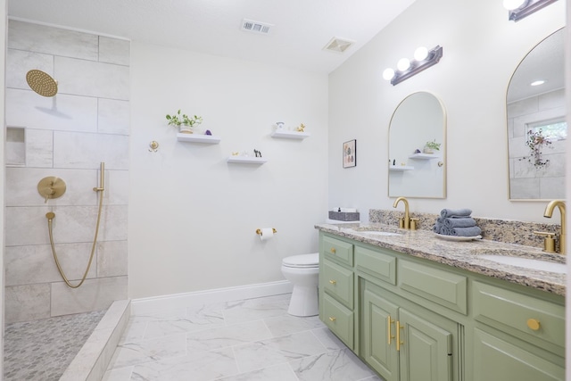 bathroom with marble finish floor, a sink, and visible vents